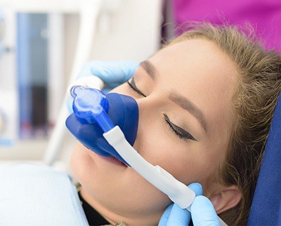 Woman with nitrous oxide sedation dentistry nose mask