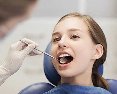 Young girl receiving dental checkup