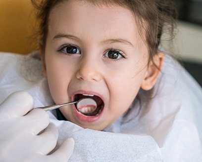 Toddler girl receiving dental exam