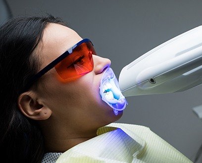 Woman receiving in office teeth whitening