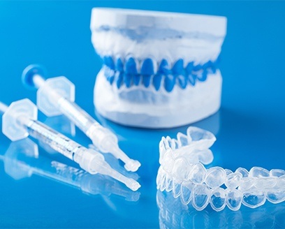 Model smile with at-home teeth whitening kit