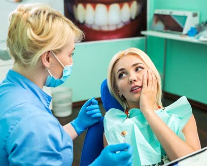 Patient and dentist discussing the cost of dental emergencies in Fort Worth