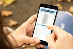 Person looking at dental insurance form on a phone