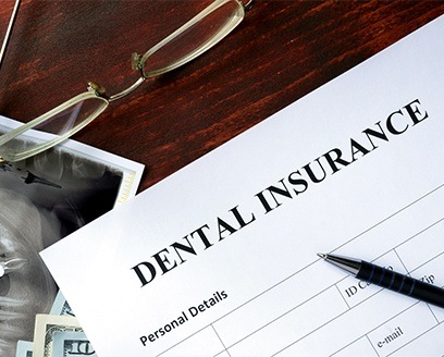 Dental insurance forms on table