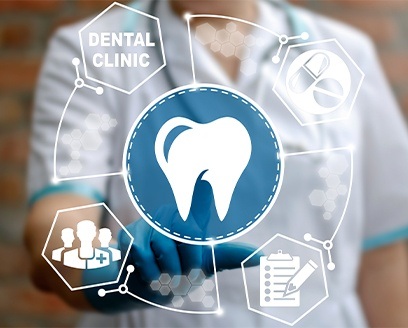 Dental team member touching hologram of icons of teeth clipboards and other dental symbols