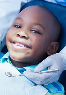 Child smiling at dental checkup