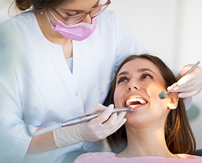 Smiling woman in dental chair during dental checkup