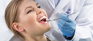 Woman receiving dental exam