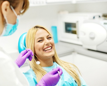 Woman at dentist for smile makeover consultation