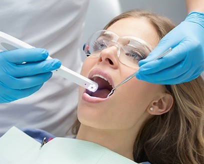 Dentist capturing intraoral images while performing a dental exam
