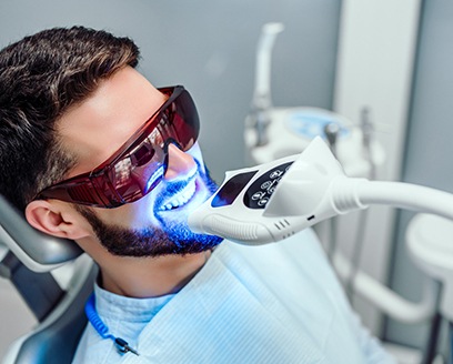 Man receiving professional teeth whitening from cosmetic dentist in Fort Worth