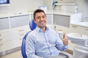 Man smiling while at his cosmetic dental consultation